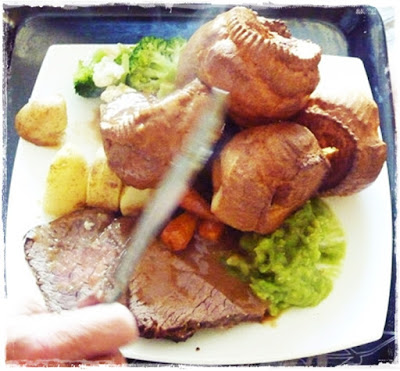 traditional roast dinner with yorkshire puddings and homemade gravy